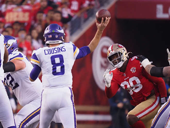 Nov 28, 2021; Santa Clara, California, USA; Minnesota Vikings quarterback Kirk Cousins (8) throws under pressure from San Francisco 49ers defensive end Arden Key (98) during the fourth quarter at Levi's Stadium. Mandatory Credit: Kelley L Cox-USA TODAY Sports